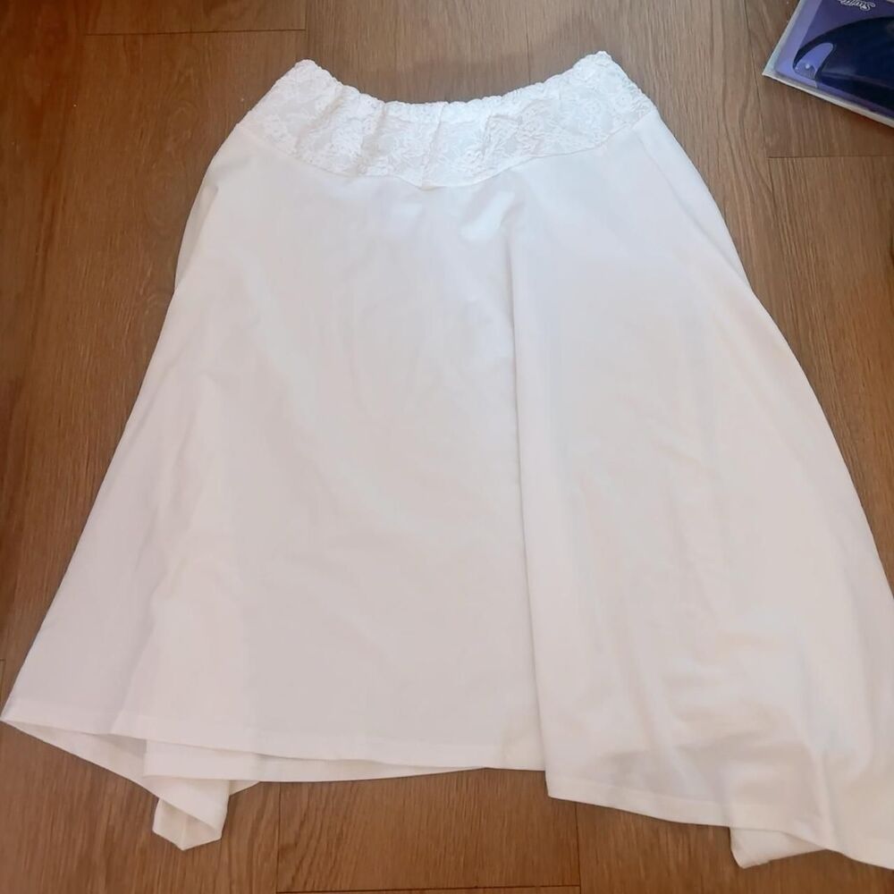White lace skirt with lace trim at waistband